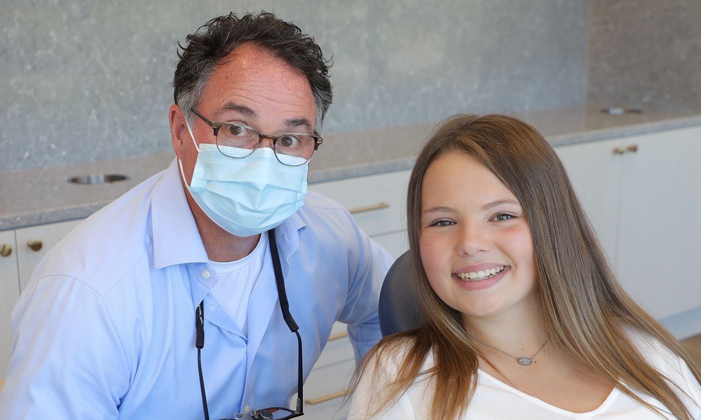 Girl smiling after transformed smile with best orthodontist in Chesapeake